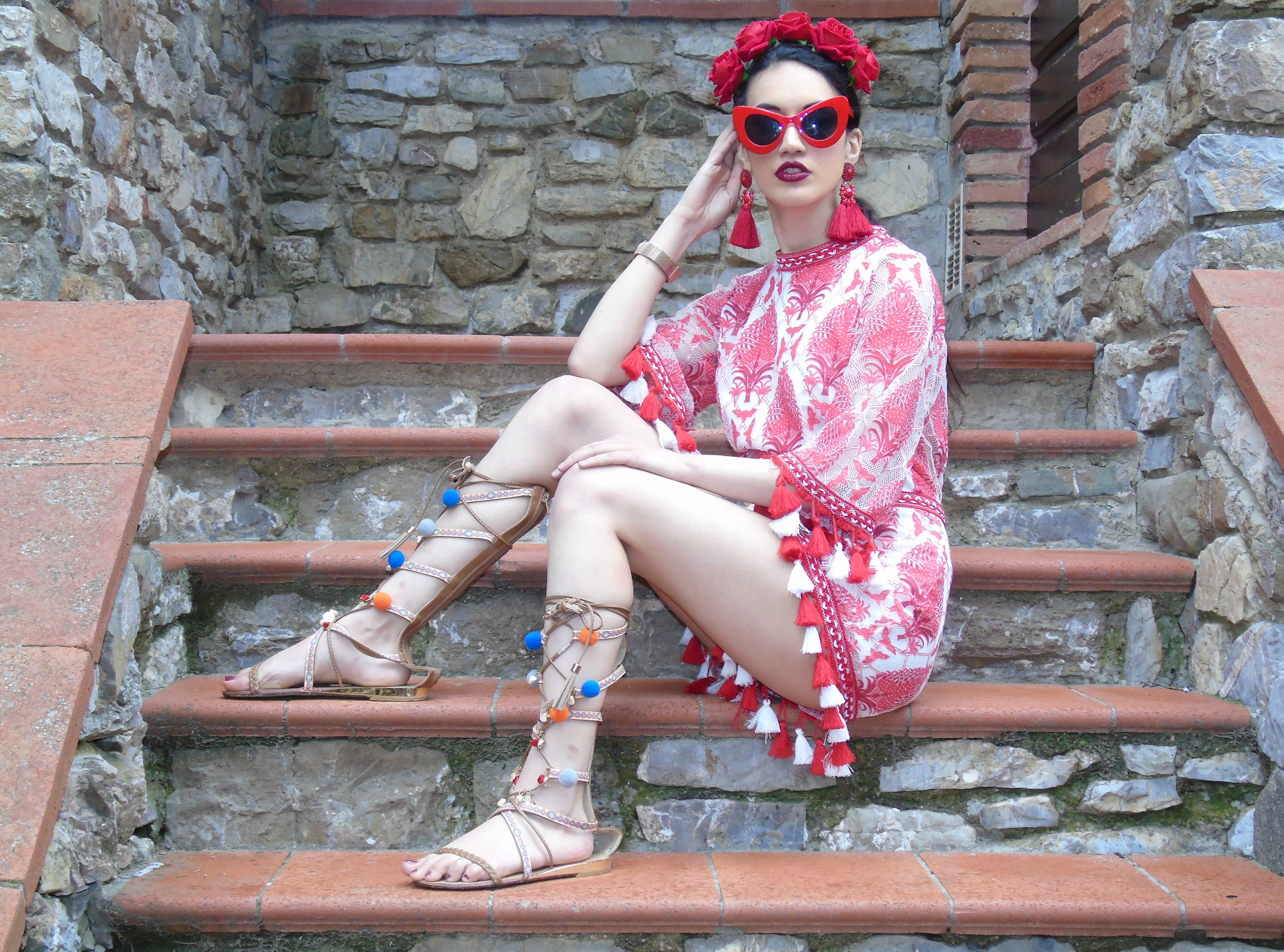 <img src="ana.jpg" alt="ana red tassel crochet playsuit what to wear on holiday in Tuscany"/>