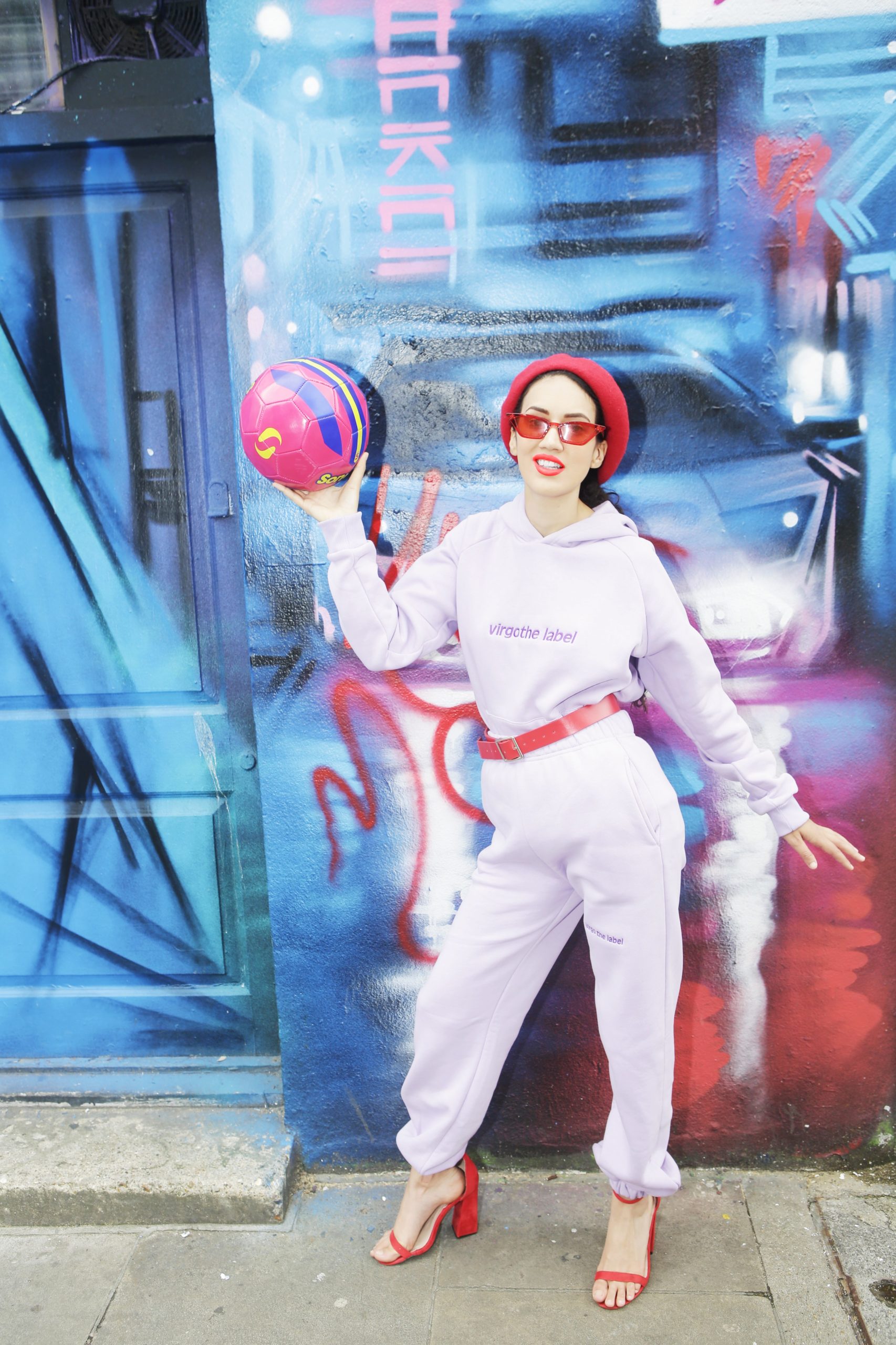 <img src="ana.jpg" alt="ana holding pink football against street art"/> 