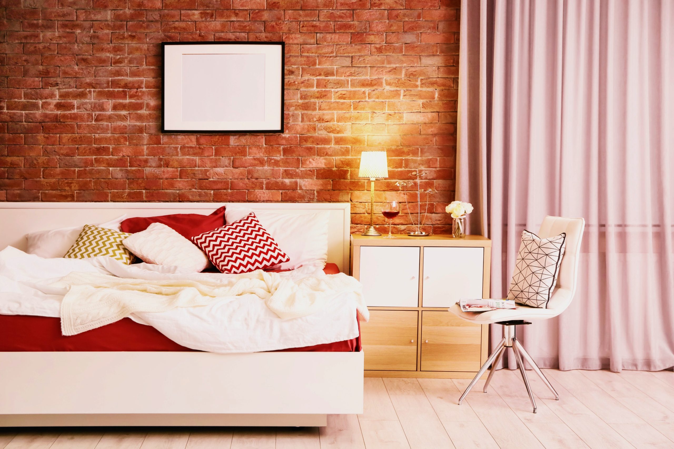 <img src="brick.jpg" alt="brick bedroom with white divan bed"/> 