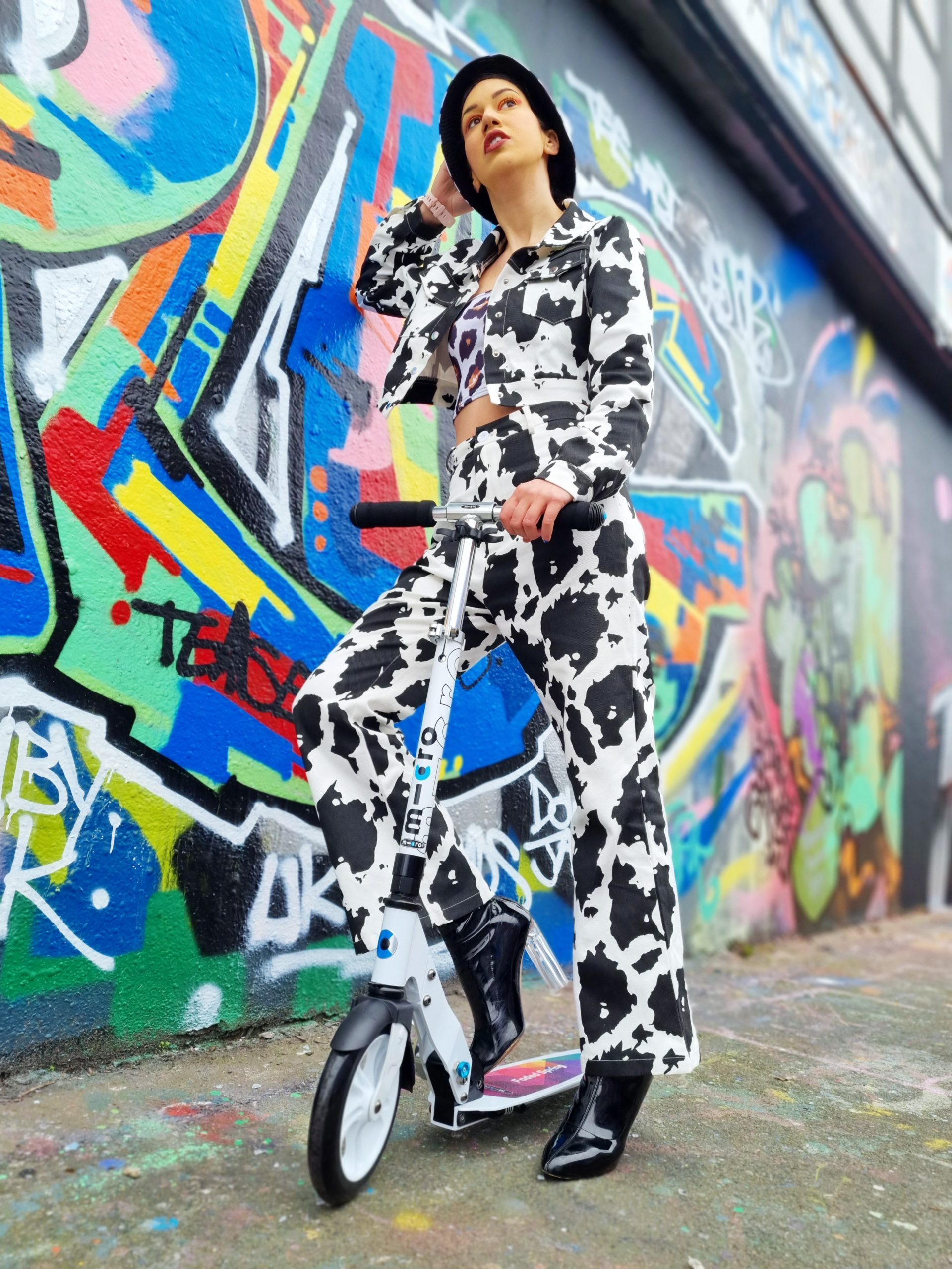 <img src="ana.jpg" alt="ana in cow print coord on micro scooter"/> 