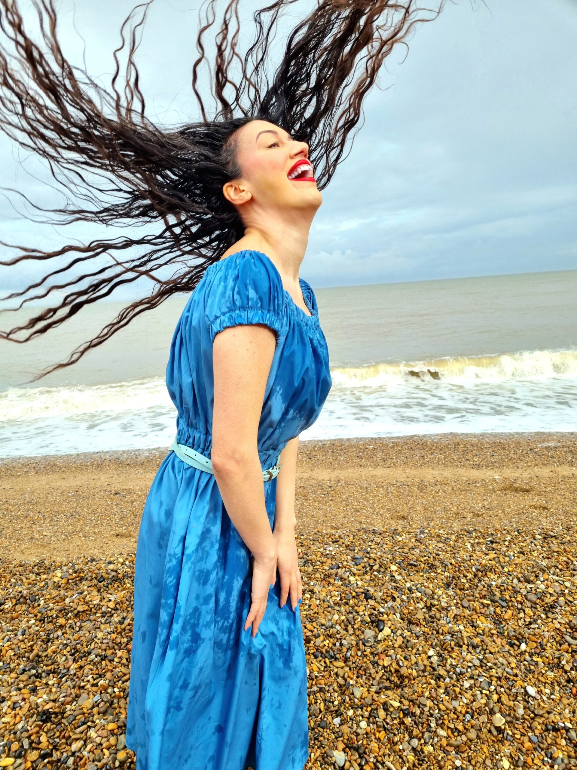 <img src="ana.jpg" alt="ana doing a hair flip on Aldeburgh Beach"/>