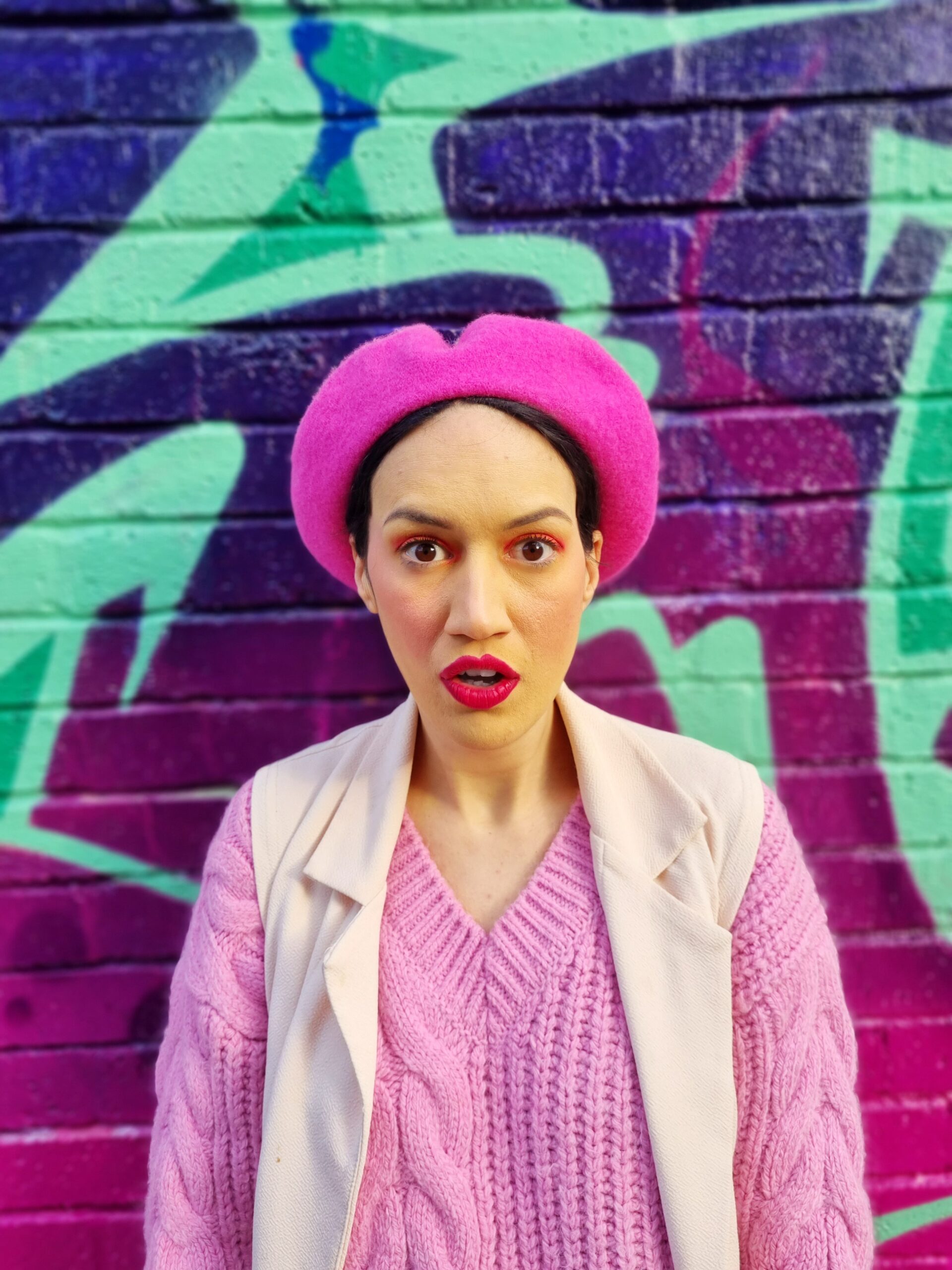 <img src="ana.jpg" alt="ana in pink beret and duster colourful clothes"/>
