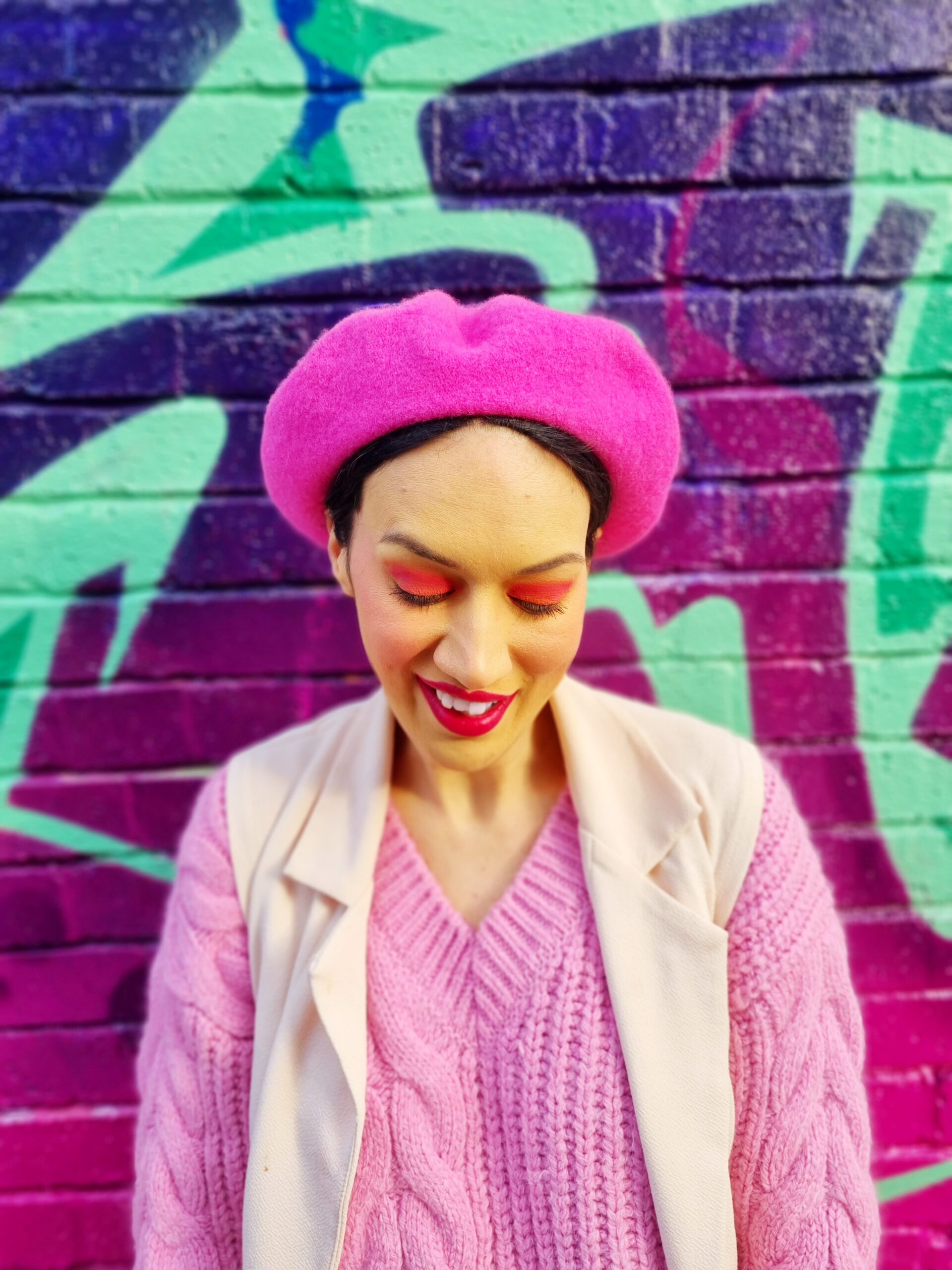 <img src="ana.jpg" alt="ana smiling in pink jumper colourful clothes"/>