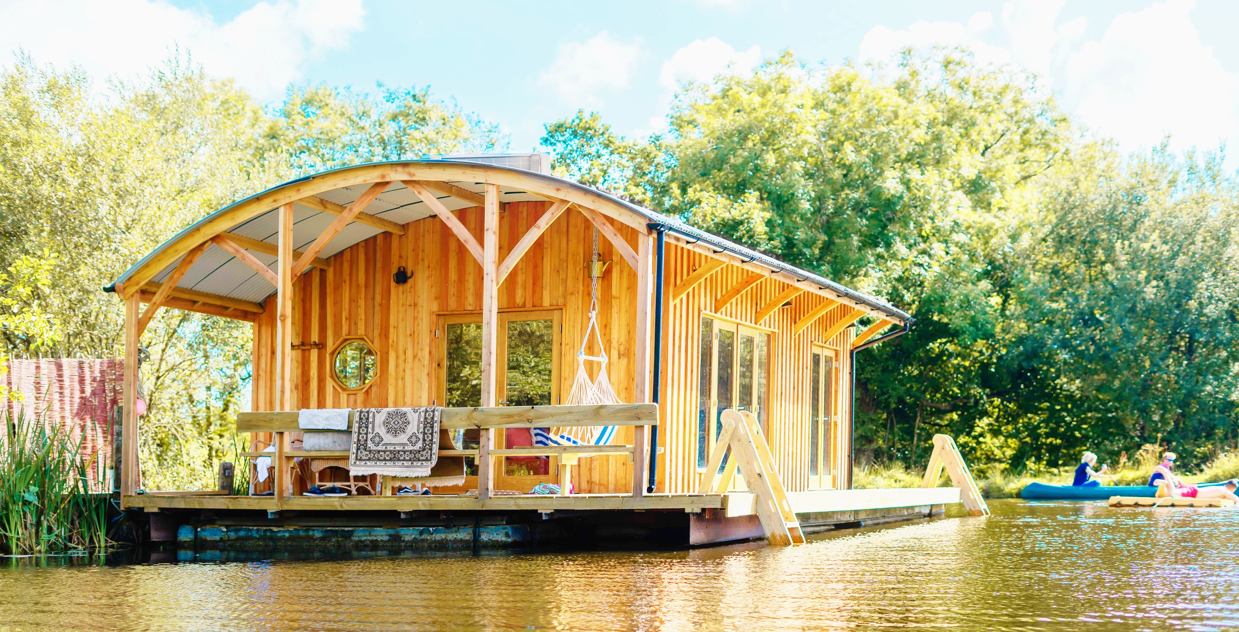 <img src="kingfisher.jpg" alt="kingfisher house boat on lake"/>