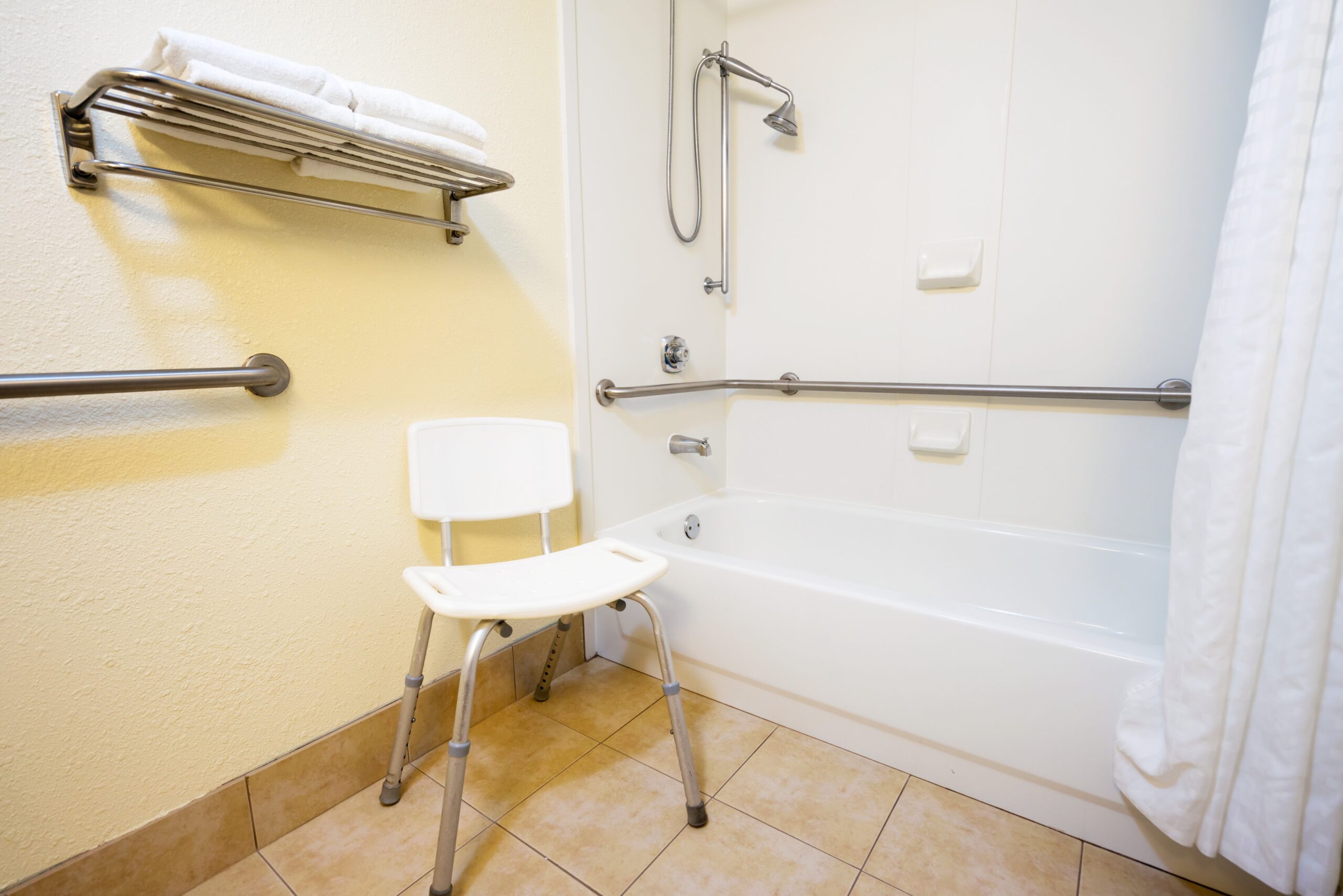 <img src="shower.jpg" alt="shower chair in minimal bathroom"/>