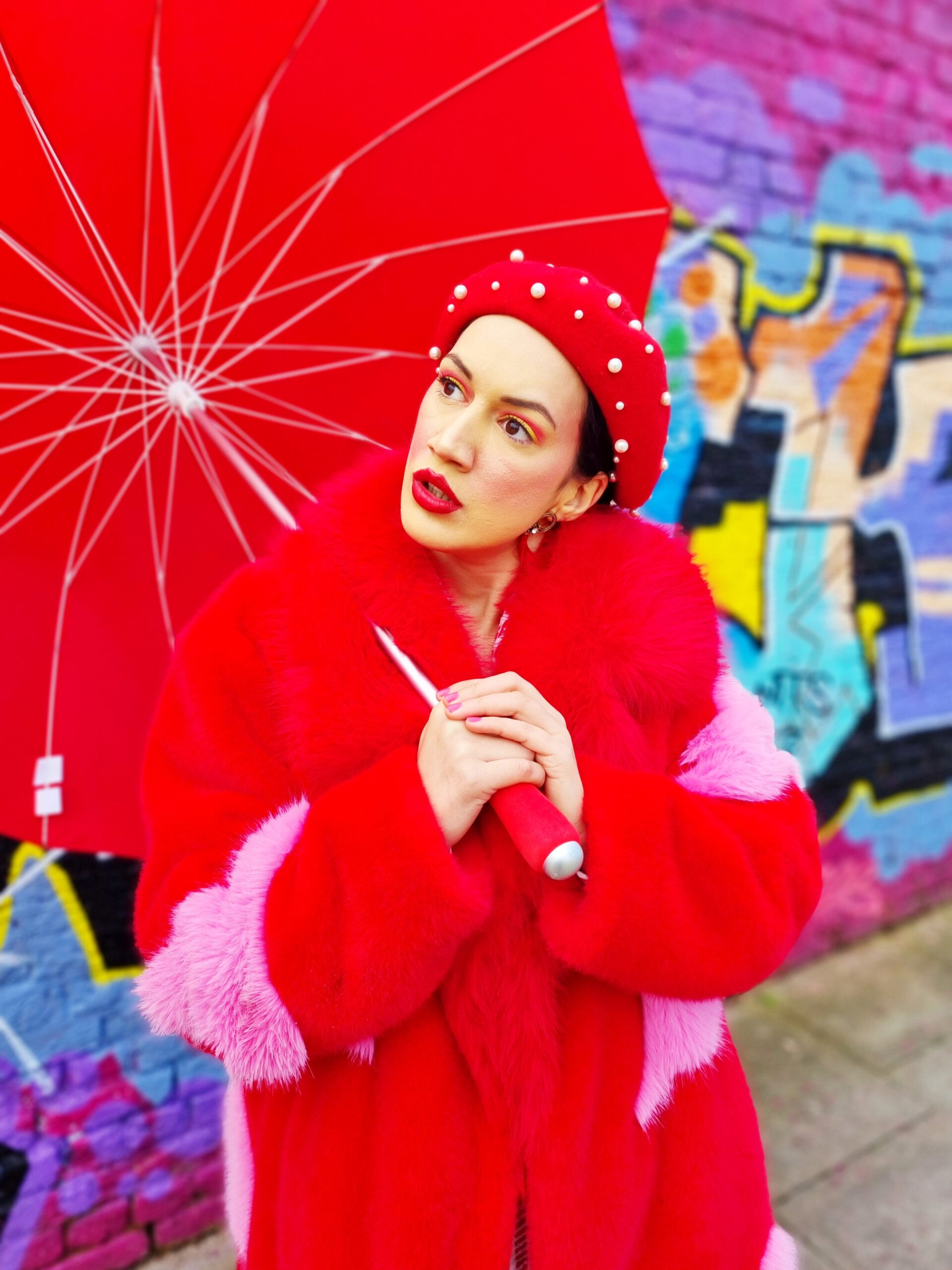 <img src="ana.jpg" alt="ana with red umbrella and fluffy coat"/> 