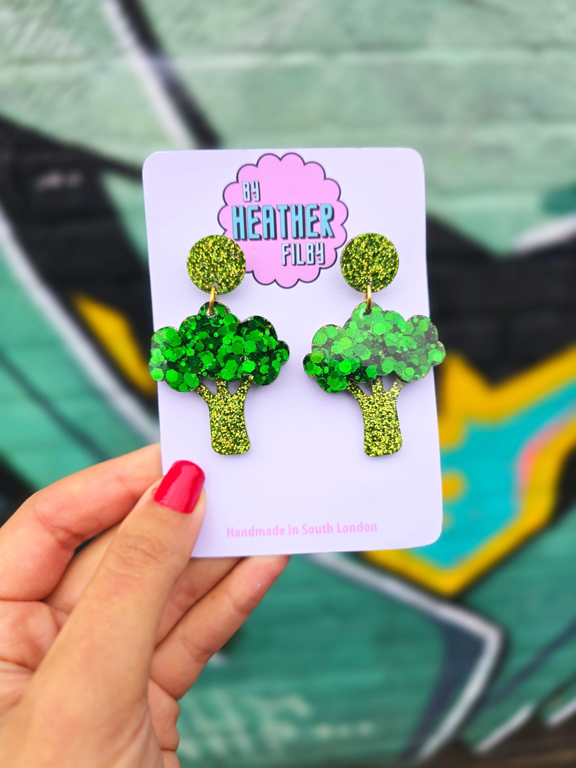 <img src="sparkly.jpg" alt="sparkly broccoli earrings ultimate vegan"/> 